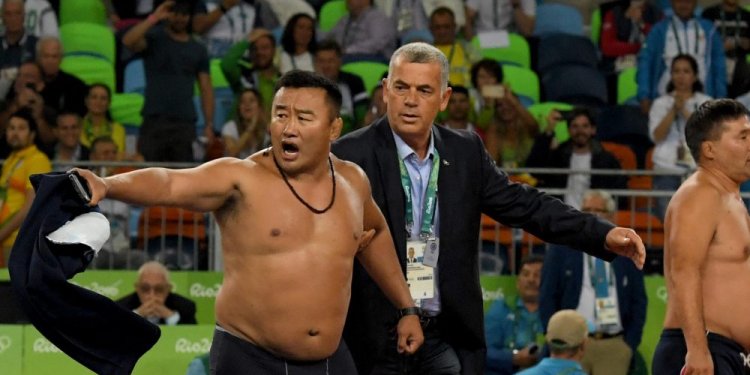 Furious wrestling coach strips