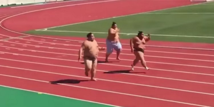 Sumo wrestlers running on a