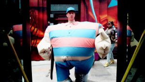 Coldplay’s Chris Martin wears a bulky outfit in the music video for ‘True Love.’