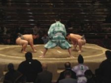 The gyoji (referee) makes for the beginning of another sumo wrestling bout.